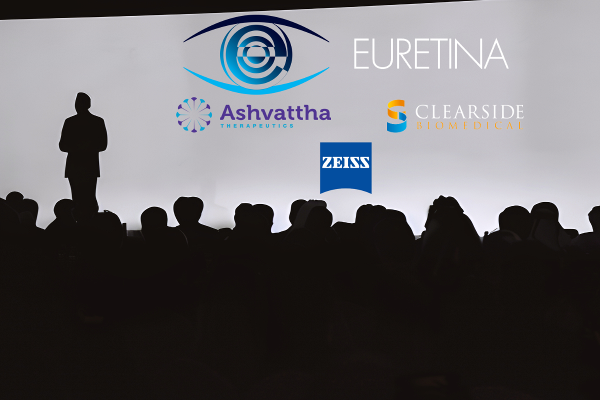 A person stands in front of a white screen, facing an audience. The speaker and audience are visible in silhouette. Concept image for European Society of Retina Specialists (EURETINA) clinical trial data presentation. Logos courtesy of EURETINA, Ashvattha Therapeutics, Clearside Biomedical and Carl Zeiss Medical Technology. Background image courtesy of TezcanKemal, Getty Images. Created with Canva.