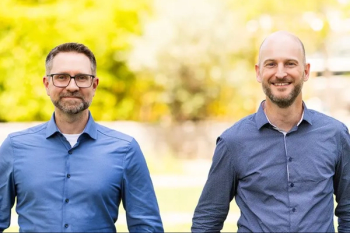 A photo showing Sebastian Rausch, PhD, clinical development manager for investigational technologies (left) and Roland Rocholz, PhD, technology and innovation manager. Image courtesy of Heidelberg Engineering