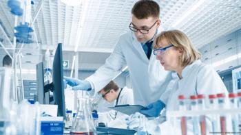 Researchers look over test results on computer Image credit: ©Gorodenkoff - adobe.stock.com