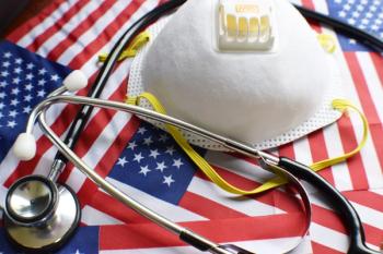 N95 mask and stethescope on American flag