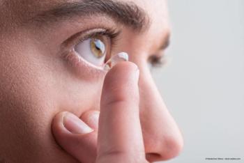 man inserts scleral lens - Image credit: Adobe Stock / ©Yakobchuk Olena
