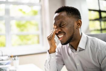 Man holding eye experiencing pain Image credit: ©Andrey Popov - adobe.stock.com
