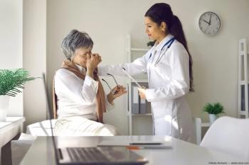 Physician consoling patient with eye pain Image credit: AdobeStock/StudioRomantic