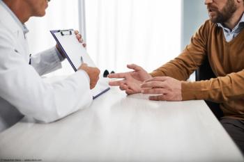 Doctor and patient discussing results Image credit: AdobeStock/YakobchukOlena