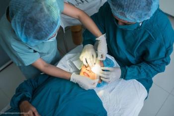 Glaucoma patient gets examined by surgeons