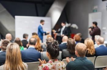 Audience and presenters at award ceremony. Image credit: AdobeStock/kasto