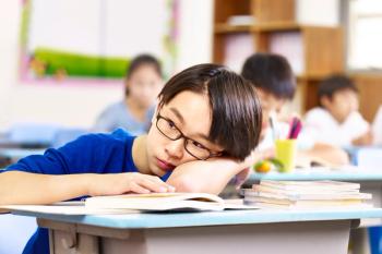 Boy in classroom Image credit: AdobeStock/imtmphoto