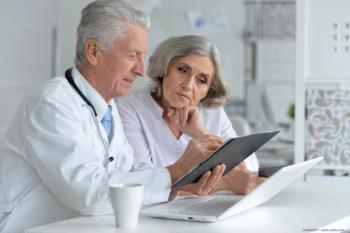 Diabetic patient reviews treatment options with eye doctor