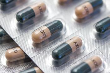 doxycycline pills are wrapped in their foil packaging, on a table