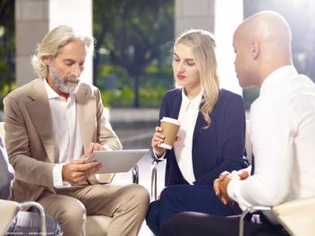 Three business people in group discussion Image credit: ©imtmphoto - adobe.stock.com