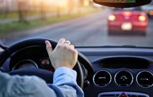 Person behind wheel driving  Image credit: AdobeStock/ambrozinio