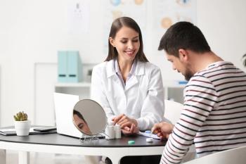 Doctor with contact lens patient Image credit: AdobeStock/Pixel-Shot