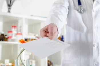 Doctor with referral note Image credit: AdobeStock/thodonal