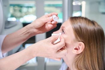 Physician administering eye drops to child Image credit: AdobeStock/ViacheslavYakobchuk