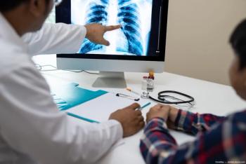 Doctor pointing to xray on computer Image credit: AdobeStock/xreflex