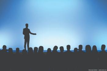 Silhouette of speaker and audience Image credit: ©Gennady Danilkin - adobe.stock.com