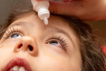 Child receiving eye drop administration Image credit: AdobeStock/vitalis83