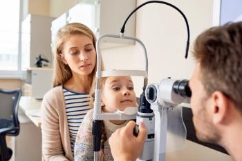 Child receiving slit lamp exam Image credit: AdobeStock/Seventyfour