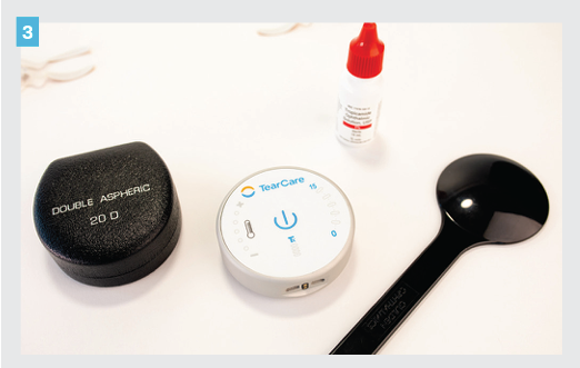 Figure 3. The TearCare device is used to heat the meibomian glands. This photo demonstrates the size for portability, comparing to a 20-D lens case and bottle of dilating drops. 