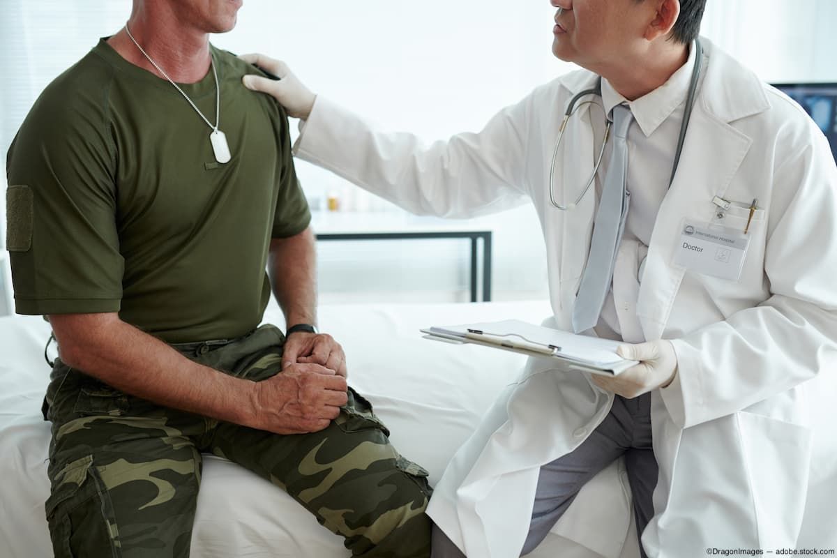 Doctor consoling veteran Image credit: AdobeStock/DragonImages