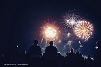 Crowd watching fireworks (Adobe Stock / NDABCREATIVITY)