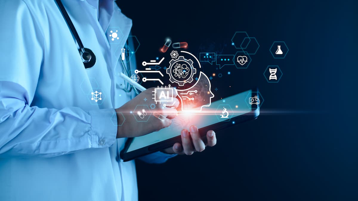 Physician on tablet with AI graphic Image credit: AdobeStock/LALAKA