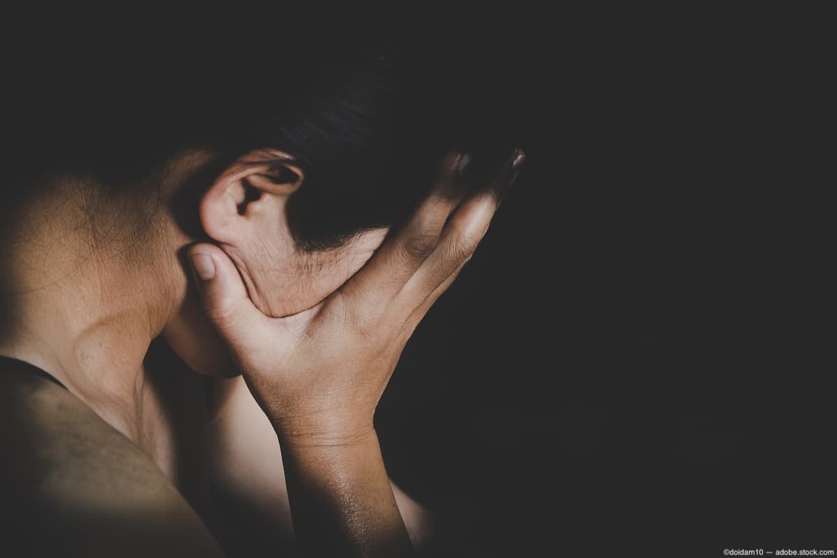 Woman covering face with hands Image credit: AdobeStock/doidam10