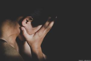 Woman covering face with hands Image credit: AdobeStock/doidam10