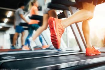 People running on treadmills Image credit: AdobeStock/NDABCREATIVITY