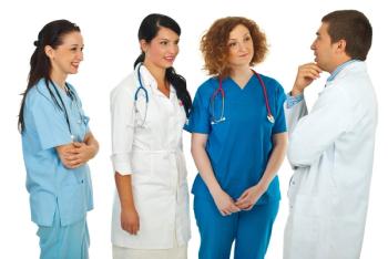doctor pondering in front of staff