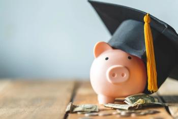 Piggy bank with graduate cap Image credit: AdobeStock/mnirat
