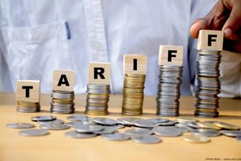 Stacks of coins with blocks spelling out "tariff" Image credit: AdobeStock/PhotixStudio
