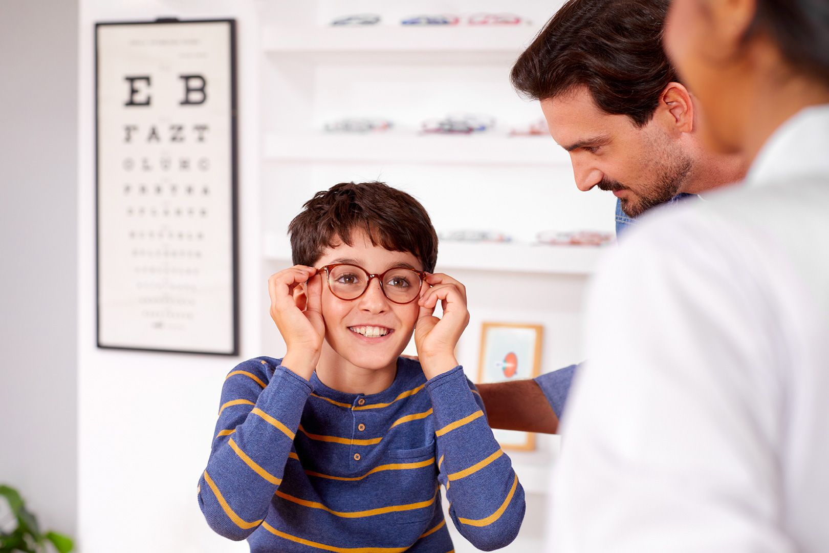 Child trying on glasses Image credit: SightGlass Vision