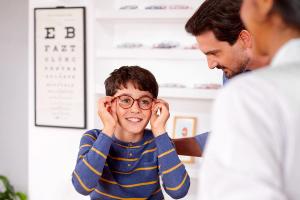 Child trying on glasses Image credit: SightGlass Vision