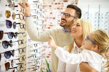 Family choosing eye glasses at optometry office Image credit: ©grki - adobe.stock.com