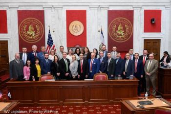 West Virginian legislators and representatives from the West Virginia Association of Optometric Physicians in the West Virginia Senate Chambers. Image credit: American Optometric Association