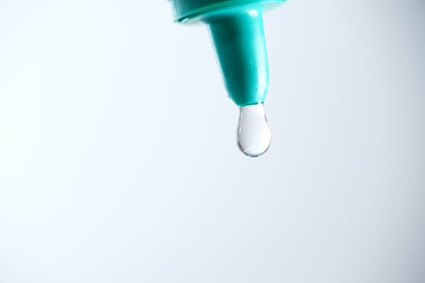 Eye drop coming from bottle Image credit: AdobeStock/taffpixture