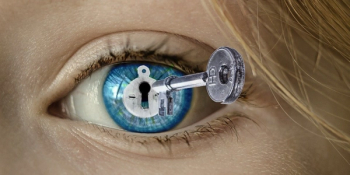 eye with lock superimposed over pupil is being opened with key