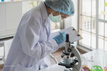 Iveric Bio scientist examines 24 month data on avancicaptad pegol (Image credit: Adobe Stock/Anun)