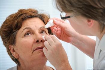 Patient having eye drops administered by physician Image credit: ©Alexander Raths - adobe.stock.com