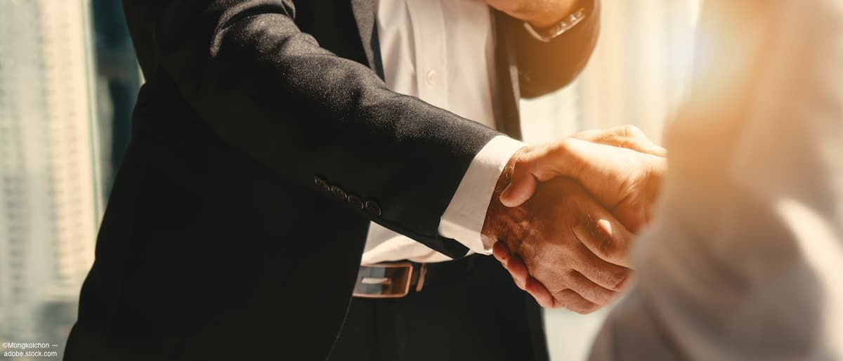 Businessmen shaking hands Image credit: AdobeStock/Mongkolchon