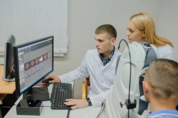 Doctors at desk looking at OCT scans on computer Image credit: ©Med Photo Studio - adobe.stock.com