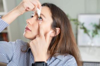 Woman using contact lens rehydrating drops