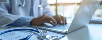 Doctor working at computer Image credit: AdobeStock/HISTOCK