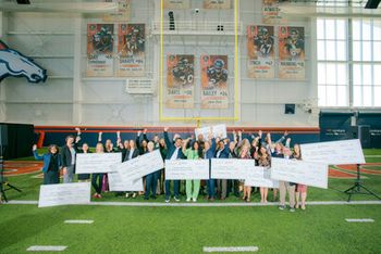 Russell Wilson and Ciara with the recipients of grants from the Why Not You Foundation - Image credit: EyeCare4Kids