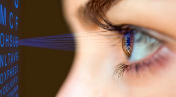 Closeup of eye looking at Snellen chart graphic Image credit: AdobeStock.muratart