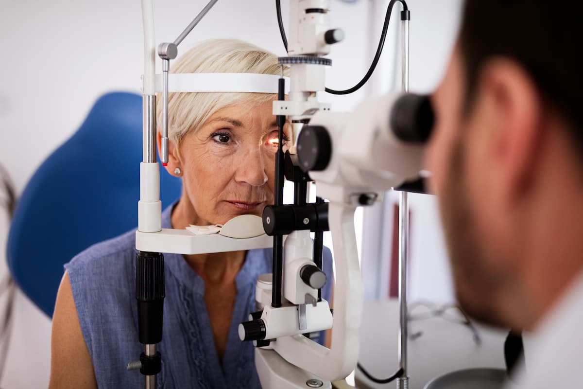 Woman receiving eye exam Image credit: AdobeStock/NDABCREATIVITY