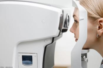 Woman sitting at OCT machine Image credit: AdobeStock/Parilov