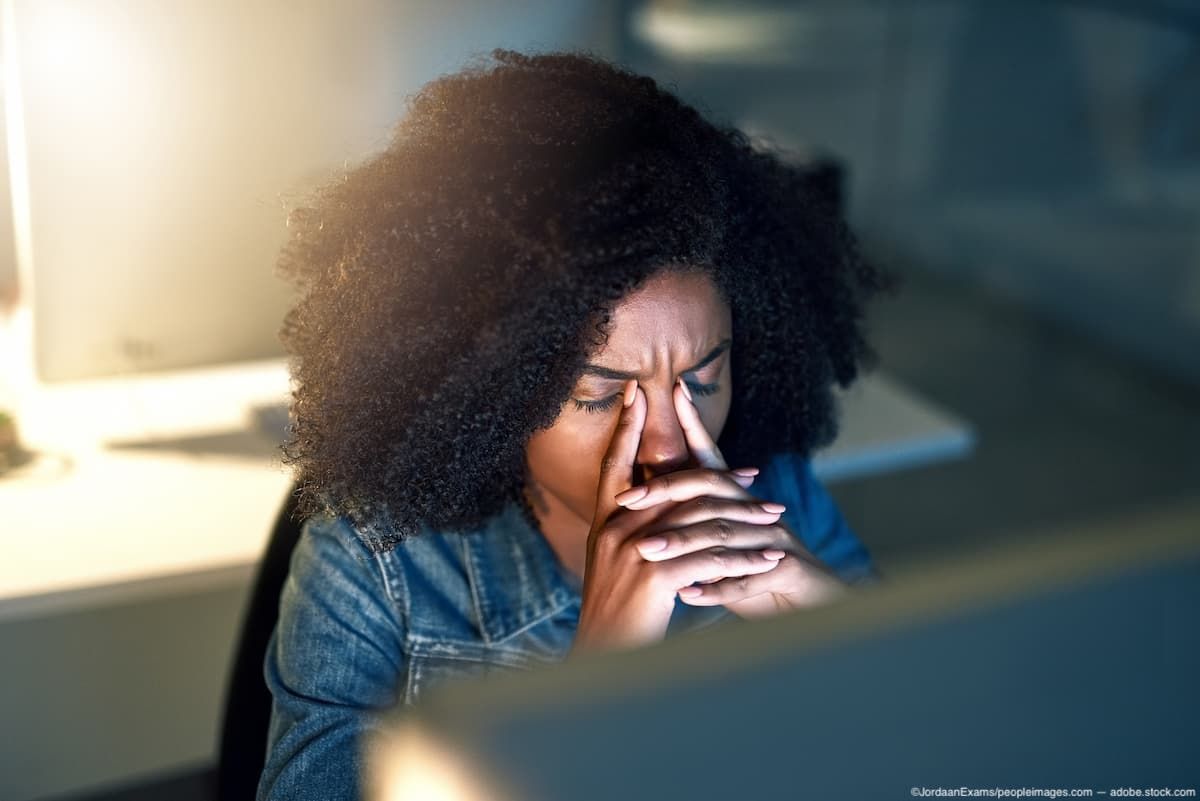 Woman at desk experiencing eye strain Image credit: AdobeStock/JordaanExams/peopleimages.com