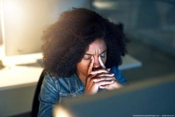 Woman at desk experiencing eye strain Image credit: AdobeStock/JordaanExams/peopleimages.com